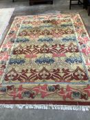 A modern Arts & Crafts style carpet, purchased from Liberty, 310 x 220cm. Condition - good