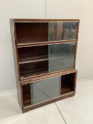 A mid century Minty style mahogany three section bookcase, width 89cm, depth 29cm, height 121cm.