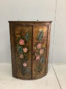 An 18th century Dutch bowfront hanging corner cupboard, later painted, width 66cm, depth 45cm,