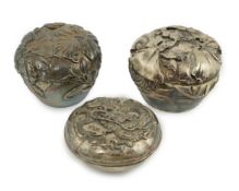 Three assorted early 20th century Japanese silver boxes with covers, two with foliate decoration,