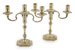 A pair of Queen Elizabeth II silver two branch, three light candelabra, by J.B. Chatterley & Sons