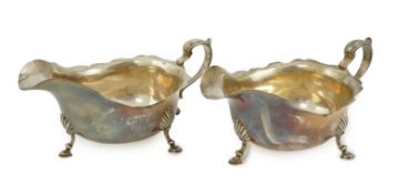 A pair of Elizabeth II silver sauce boats, maker A over HA, on three hoof feet, Birmingham, 1960,