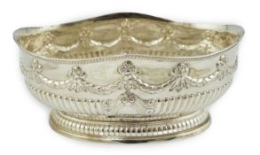 A late Victorian demi-fluted silver oval fruit bowl, by Martin, Hall & Co, with swag decoration,