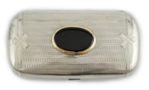 A late 19th Russian part engine turned 84 zolotnik silver and oval black agate inset oval cigar