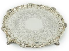A large Victorian engraved silver salver, by Henry Wilkinson & Co, with engraved scroll