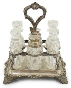 An early Victorian silver rectangular cruet stand, maker WE?, with single handle, foliate decoration