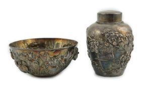 An early 20th century Japanese silver ovoid tea caddy and cover, decorated with prunus, together
