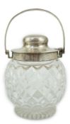 A George V silver mounted cut glass patent action biscuit barrel, by Hukin & Heath, with interior