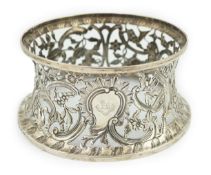 A George III Irish silver dish ring, by Matthew West, with engraved armorial and decorated with a