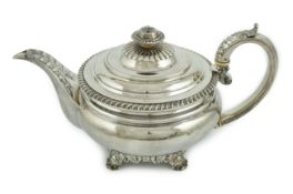 A George IV silver squat circular teapot, by Eames & Barnard, with engraved inscription to the base,