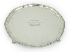 A George V silver salver, by George Howson, of shaped circular form, with engraved inscription,