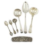 A collection of assorted 18th century and later silver flatware, including table spoons,