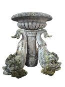 A reconstituted stone bird bath