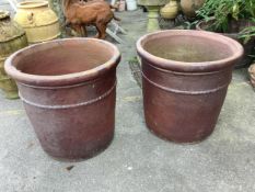 A large pair of brown glazed pottery garden urns, diameter 58cm, height 57cm. Condition - weathered,