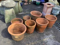 Twenty assorted terracotta planters, largest height 40cm, diameter 42cm, a terracotta pedestal,