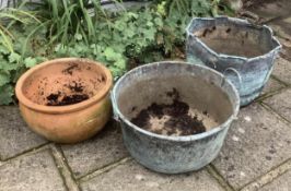 Two copper planters and one terracotta planter, planting removed, largest height 46cm. Condition -
