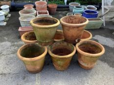 A matching set of eight terracotta garden pots, height 33cm, diameter 38cm. Condition - used and