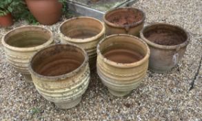 A set of four Minos Italian style terracotta planters, height 35cm, depth 40cm, and a pair of