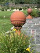 A large pair of Victorian terracotta ball finials, height 64cm, diameter 46cm. Condition -weathered,