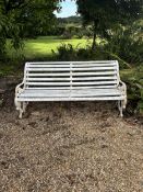 A white painted wrought iron and wood slatted garden bench, 163cm. Condition - weathered,