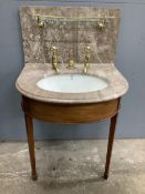 A marbled topped mahogany wash basin with John Bolding & Sons Erno ceramic basin and brass metal