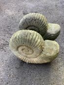 A pair of reconstituted stone 'ammonite' garden ornaments, length 47cm, height 40cm. Condition -