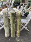 A set of three plain stone columns, diameter 15cm, height 96cm. Condition - weathered condition, one