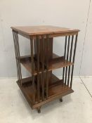 An Edwardian inlaid rosewood revolving bookcase, width 52cm, depth 52cm, height 87cm. Condition -