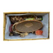 A quantity of African and Asian tribal carvings, basket woven dishes etc., largest dish 50cm