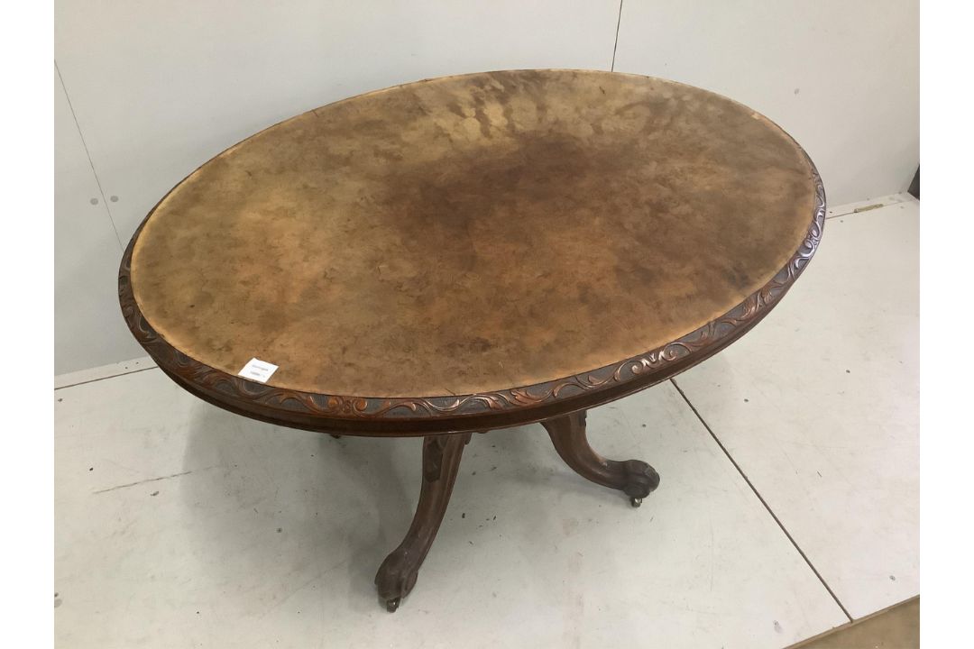 A Victorian carved walnut oval tilt top breakfast table, 120 x 92cm, height 72cm. Condition - fair - Image 1 of 3