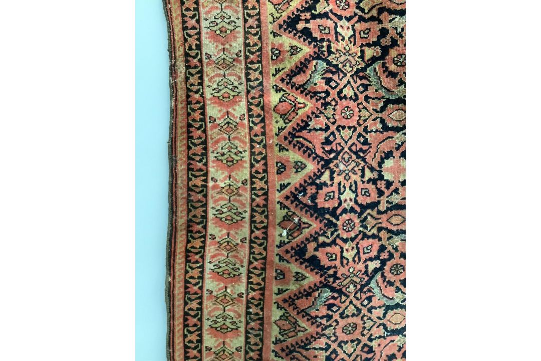 A Caucasian red ground rug, 192 x 129cm. Condition - faded and worn - Image 2 of 3