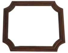 An antique French walnut wall mirror, of plain moulded cartouche form, width 140cm, height 117cm.