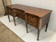 A Regency mahogany sideboard, with a concave front, width 199cm, depth 76cm, height 90cm.