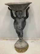 A lead bird bath with cupid stem, height 73cm. Condition - weathered with some old dents and