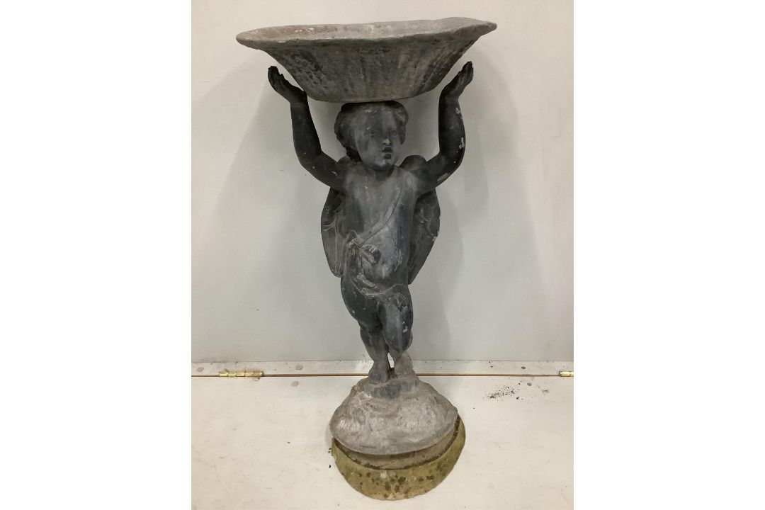 A lead bird bath with cupid stem, height 73cm. Condition - weathered with some old dents and - Image 1 of 2