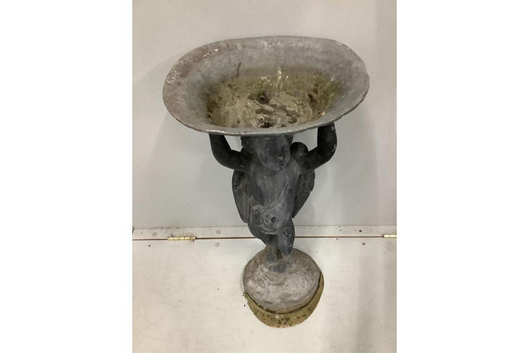 A lead bird bath with cupid stem, height 73cm. Condition - weathered with some old dents and - Image 2 of 2