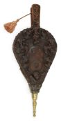 A pair of 17th century carved walnut and oak bellows, the front carved with heraldic motifs and a
