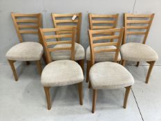 A modern Ercol elm extending dining table and six chairs, table 150cm extended, depth 89cm, height