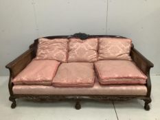 A 1930's mahogany three piece Bergere suite, with double caned arms and single caned backs.