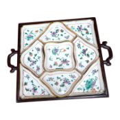 A square Chinese hardwood tray of famille rose geometric dishes, 30cm. Condition - fair to good