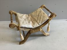An 18th century style giltwood X frame dressing stool, width 76cm, depth 46cm, height 53cm.