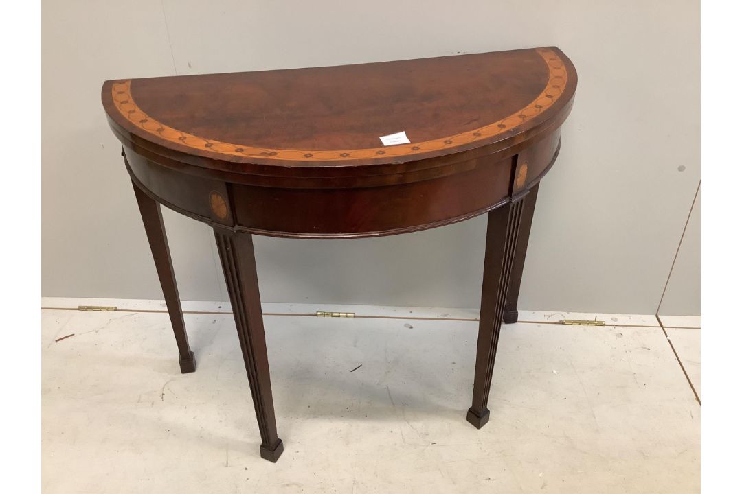 An Edwardian inlaid mahogany demi lune card table, width 91cm, height 73cm. Condition - top - Image 1 of 2