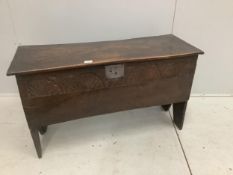 An early 18th century oak six plank coffer, with a lunette carved front, width 103cm, depth 38cm,