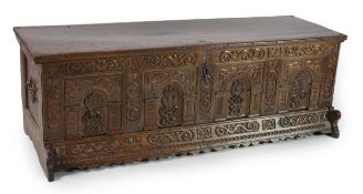 A mid 18th century German carved oak marriage chest, with single planked lid, the frieze, initialled