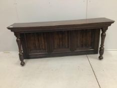 A section of linen fold panelling mounted as a sideboard back, width 165cm, height 65cm. Condition -