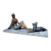 A French Art Deco spelter figure group, woman and dog, on marble base, signed H. BAL, 40cm long.