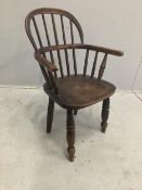 A Victorian ash and elm Windsor child's elbow chair, width 43cm, depth 28cm, height 60cm.