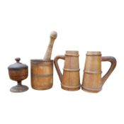 A pair of staved beech flagons, 23cm high, a wooden pestle and mortar, 17.5cm, and turned wood