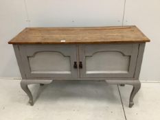 An early 20th century oak low dresser, later painted, width 129cm, depth 47cm, height 86cm.
