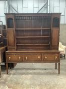 A George III mahogany banded oak dresser with boarded rack, width 182cm, depth 45cm, height 204cm.